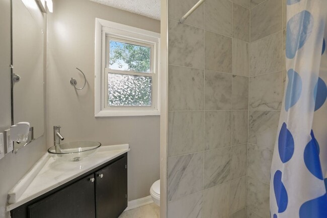 Building Photo - Move-In Ready Cape Cod with 3 Finished Levels & Huge Backyard