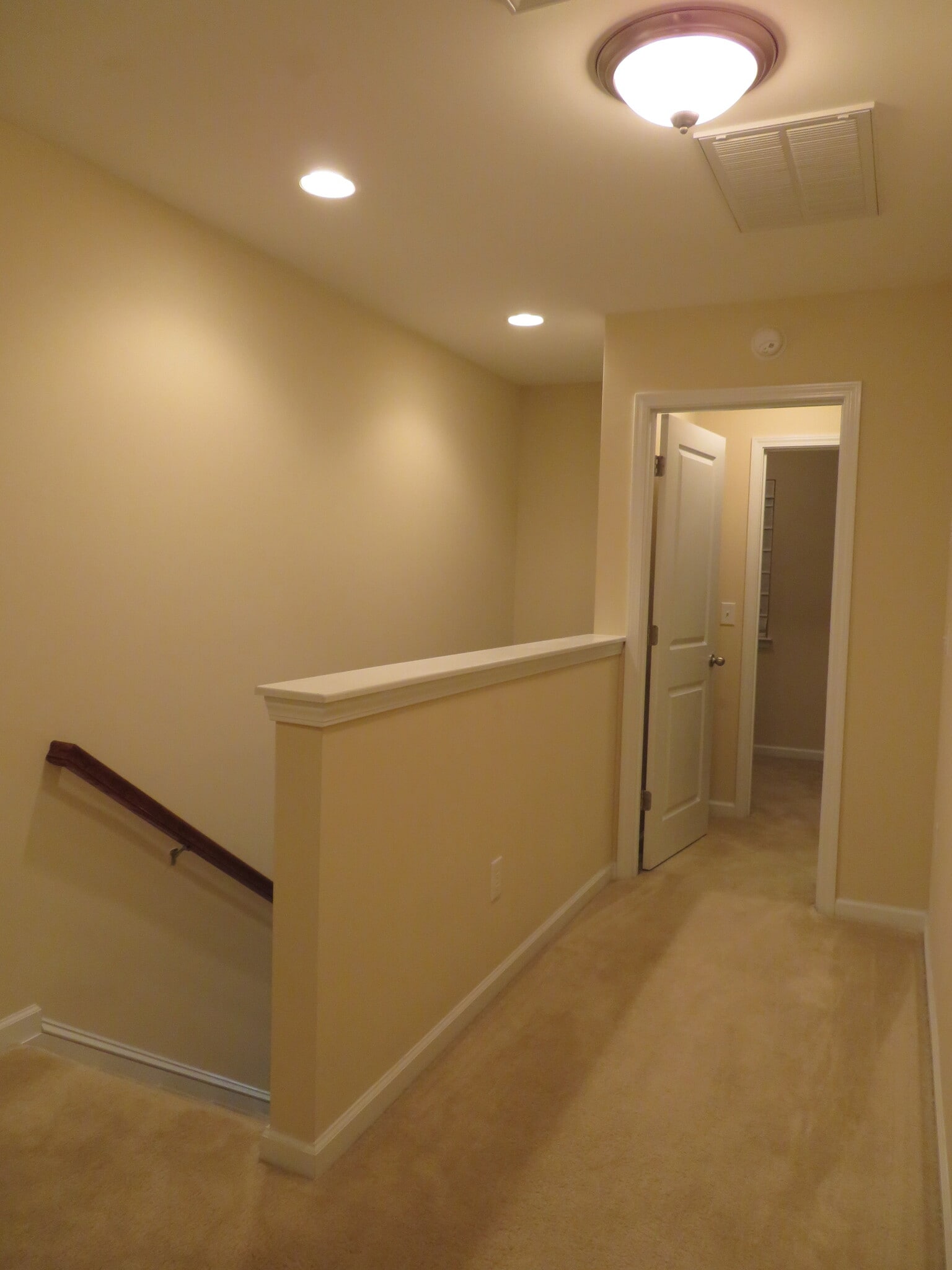 Stair landing to Master Suite at the front of the home - 2496 Stadium Dr