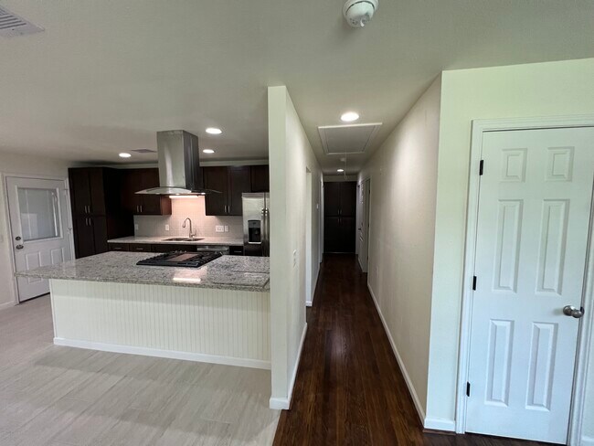 Hallway to 3 bedrooms and 1-1/2 bath tandem. - 6015 Heffernan St