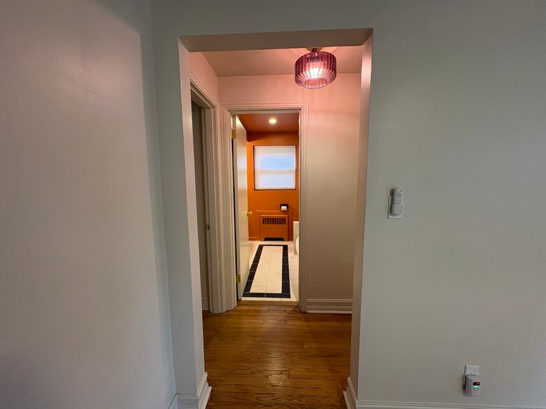 Hallway leading to updated bathroom - 6035 Oakwood Ave