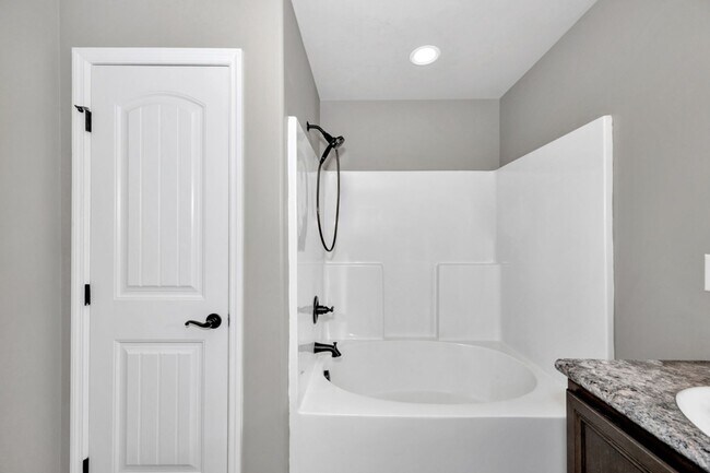 Building Photo - Fresh Paint & New Carpet! 4BR with Fenced Yard