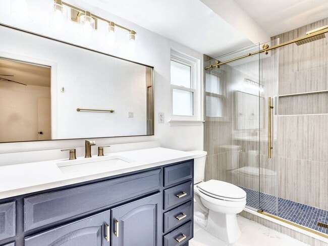 Building Photo - Charming 4BR / 2BA Home Featuring Fireplace, White Cabinets & Big Tree