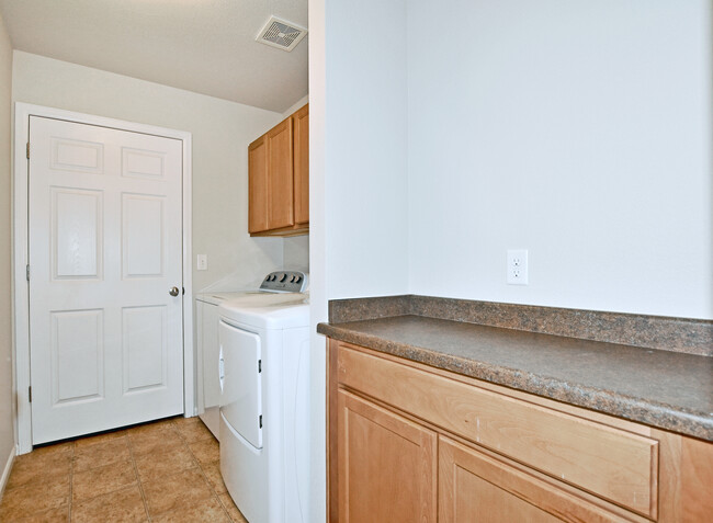 Upstairs laundry with machines included and additional storage - 6349 Orchard Park Dr