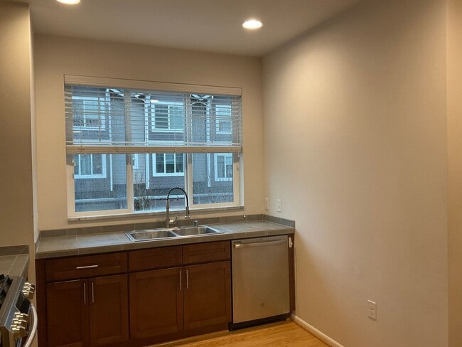 Building Photo - Riverfront Townhome with Tandem Garage & Fenced Yard