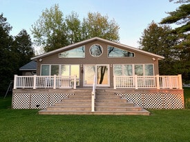Front of house. Deck access from door, stairs, and ramp. - 6 Sandy Cv