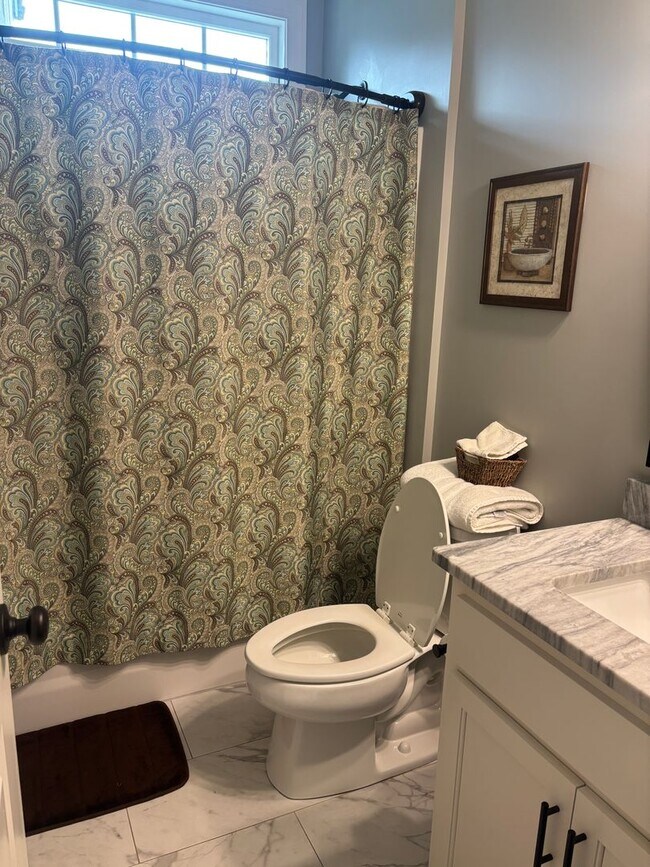 Building Photo - Spacious 4BR/3BA Creekside West Home with Screened Porch, Fenced Yard & 3-Car Garage