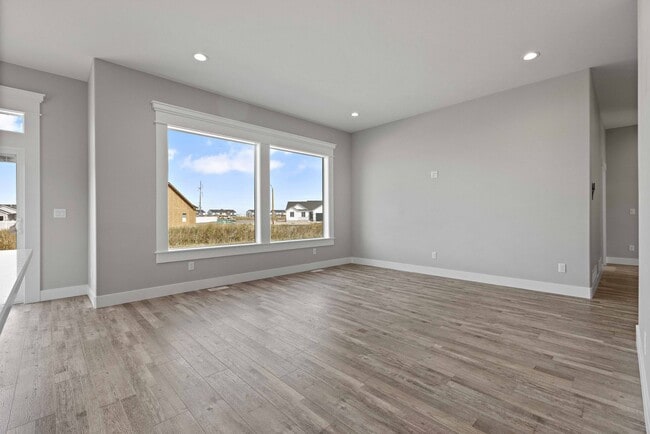 Building Photo - NEW HOME with large garage stalls and unfinished basement for additional storage