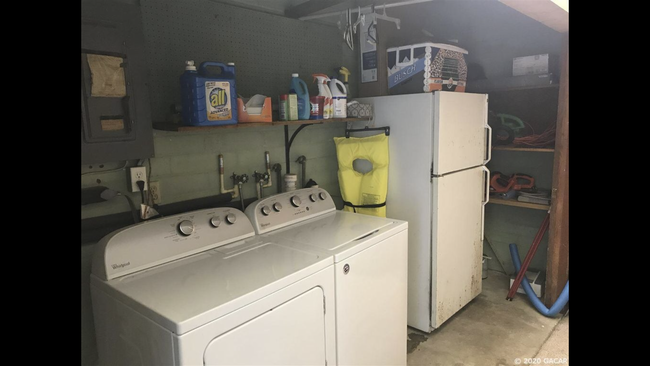 Washer and dryer in garage - 3125 W University Ave