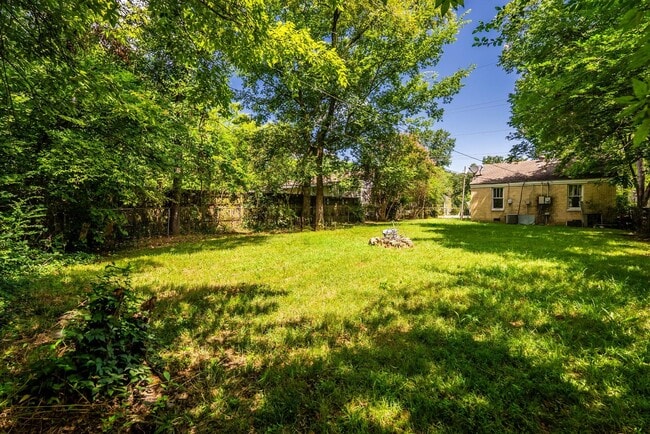 Building Photo - Charming 2BR/1BA Brick Cottage — Hardwoods, Fenced Yard, W/D Included