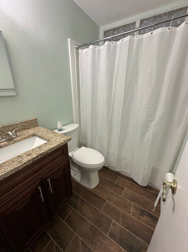 Building Photo - Unique Find! HUGE detached garage/workshop, 3 bedroom, 1 1/2 bath home, screened porch