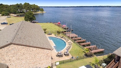 Building Photo - Welcome to your lakeside sanctuary in the gated Lake Pointe condominium community on Lake Conroe....