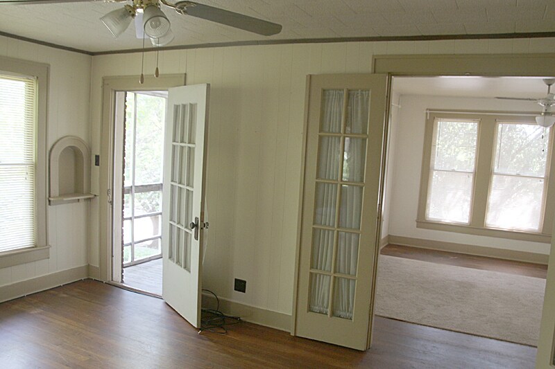 Living room mlooking into bedroom and screened in porch - 3228 Washington St
