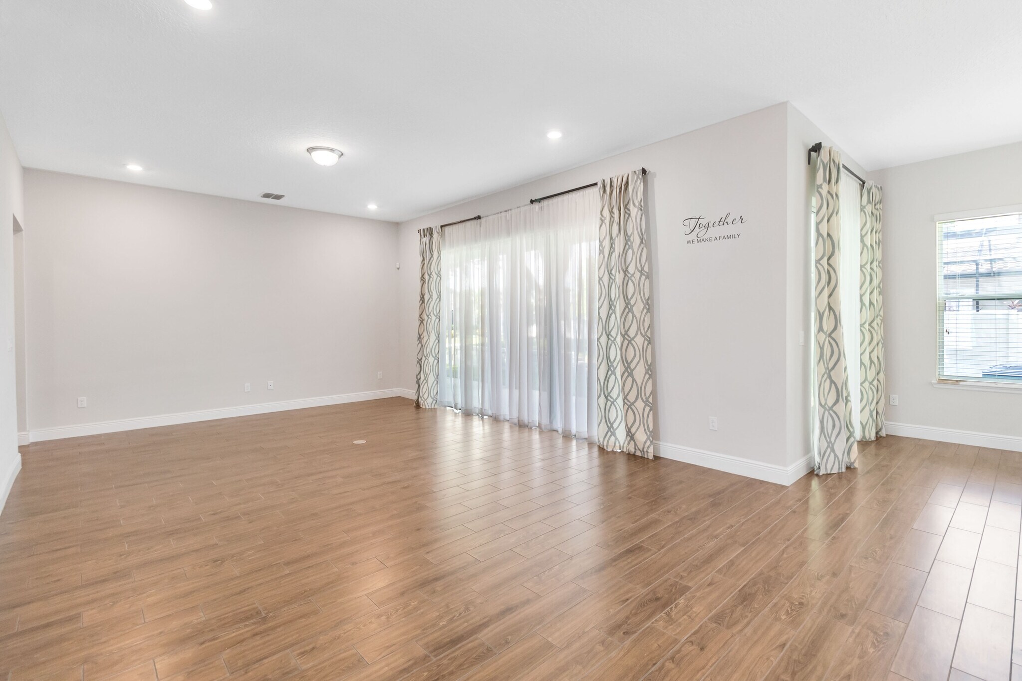 living room, sliding door to backyard. - 16753 Gullfloss Ter