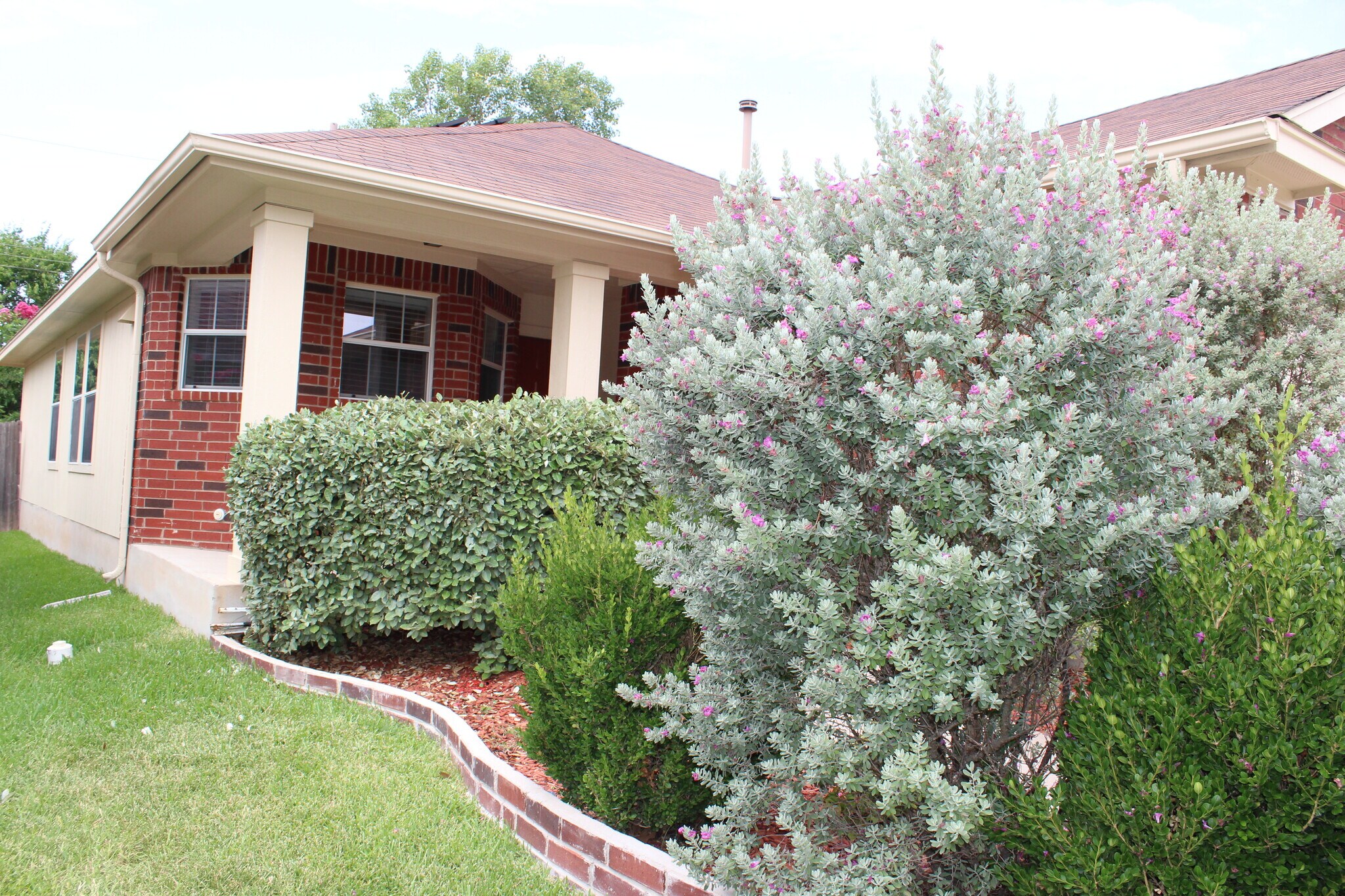 Entrance with flower garden - 5605 Bentsen Ln