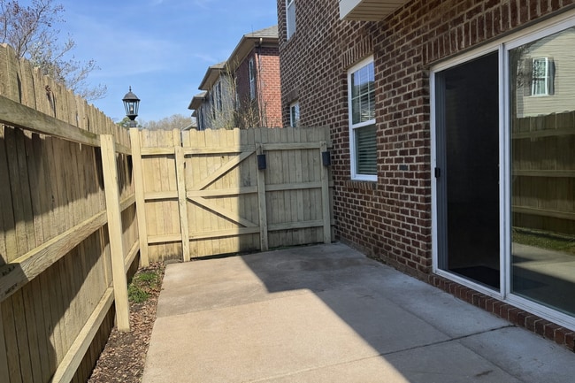 Building Photo - Spacious End-Unit Condo with Dual Primary Suites & Bonus Room