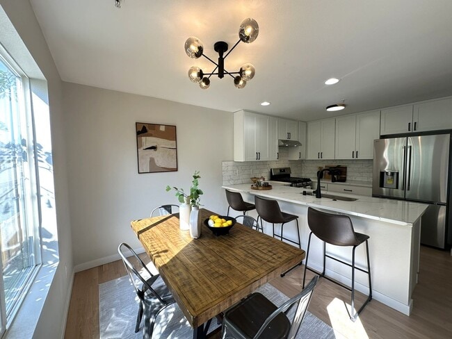 Building Photo - Updated 3-Story Condo with Balconies in So...