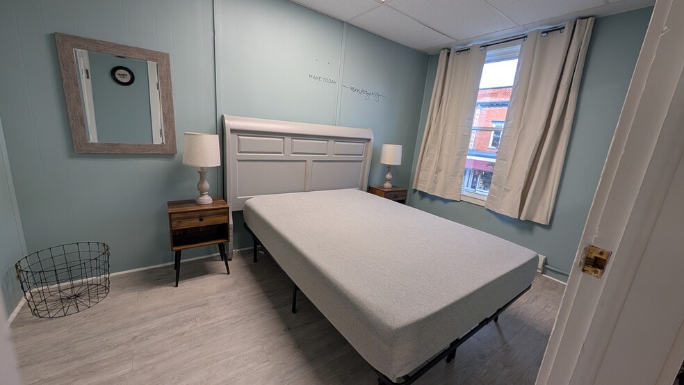 Furnished bedroom with Full size bed - 113 N Main St