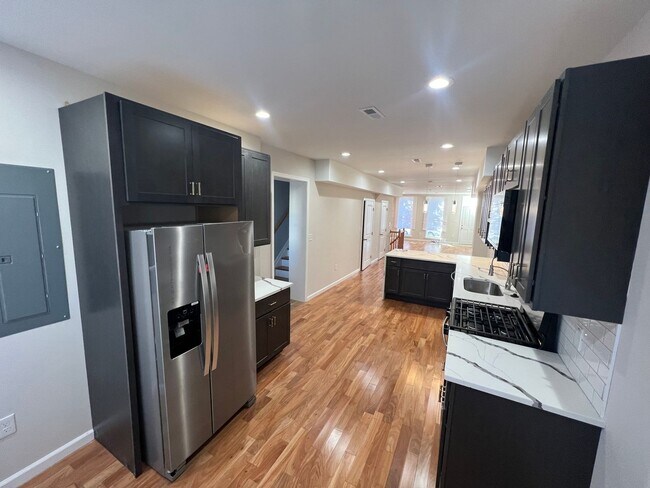 Building Photo - East District 3 BR/3.5 BA End Row Home w-Private Parking