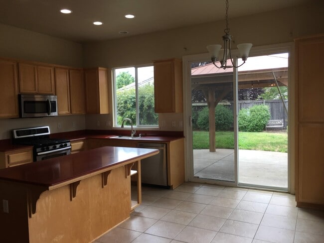 Breakfast nook looking into backyard - 6461 Cormorant Cir