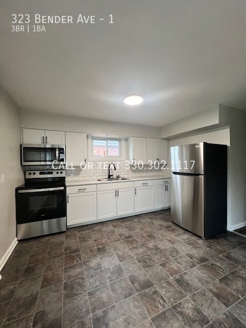 Building Photo - Completely remodeled upper level apartment...