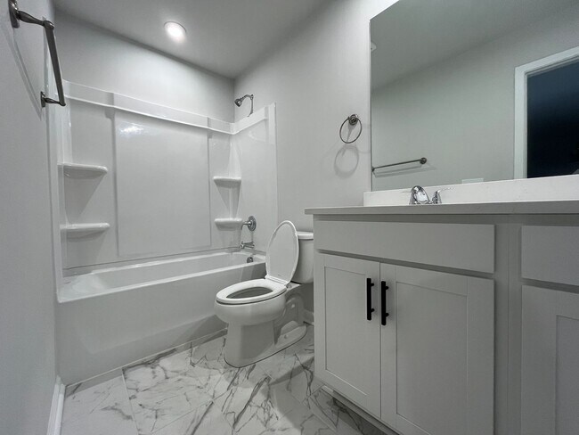 Building Photo - New 4/3 Townhome Available Now