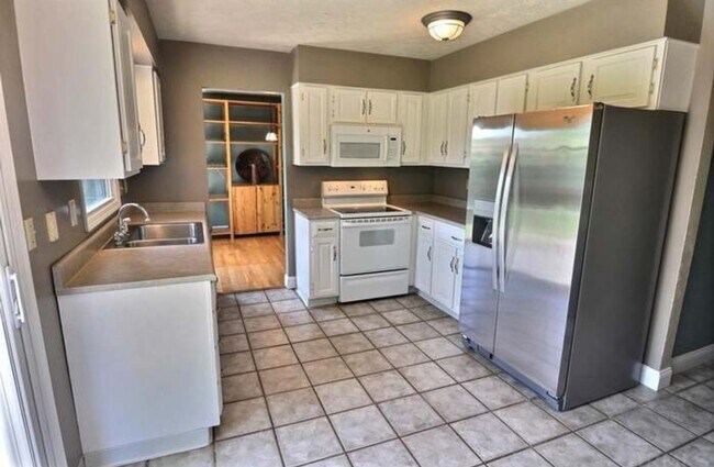 Building Photo - Beautiful 4-Bedroom Home on Spacious Corne...