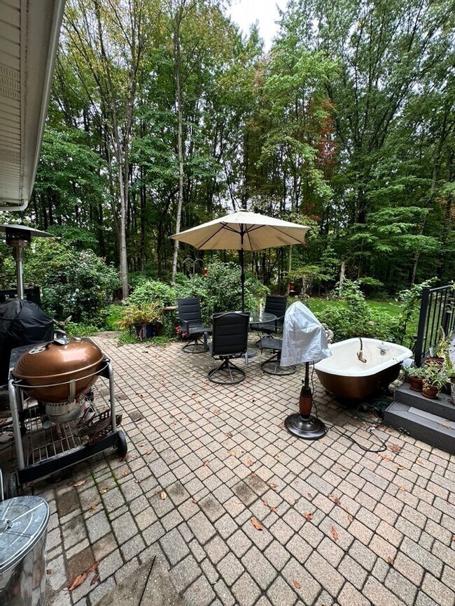 Building Photo - Dream Home in Highland, Michigan: Your Private Oasis on 5 Wooded Acres