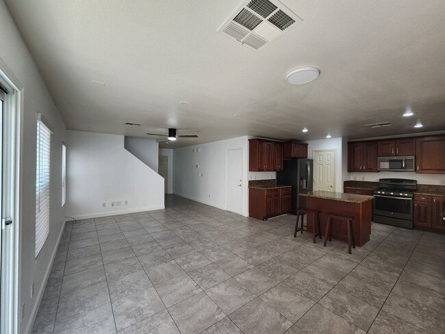 Building Photo - Sleek 2 story home with tile in most living areas and upgraded kitchen.