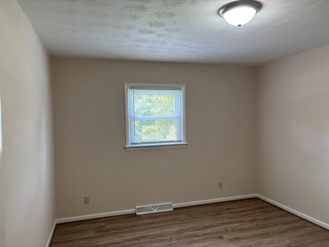 Building Photo - Nice brick home, single carport, storage b...