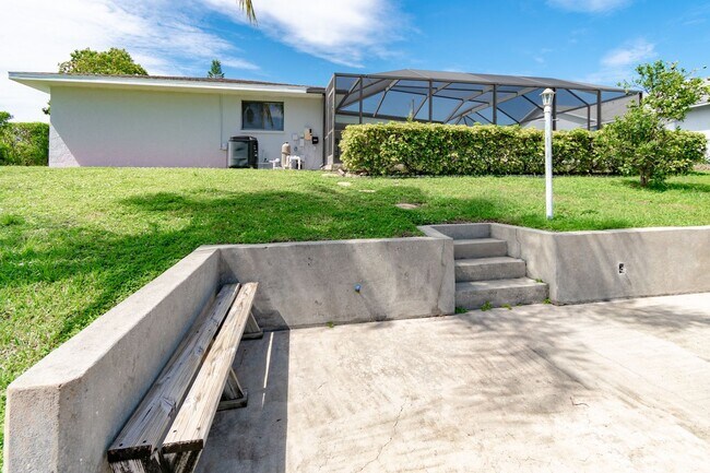 Building Photo - Gulf Access Pool Home. 4BED/2BATH. SE OF CAPE CORAL FL. Special Offer! Qualify for a deposit-free...