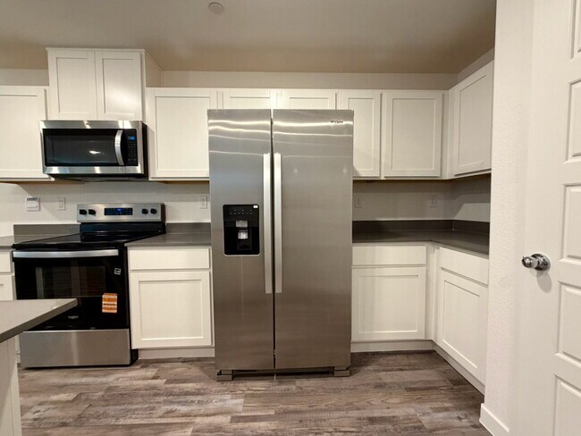 Building Photo - 2026 BRAND NEW 3 BED 2.5 BATH 2 CAR GARAGE TOWNHOUSE W/ LOFT, SOFTENER, RO FILTER, EV CHARGER & O...