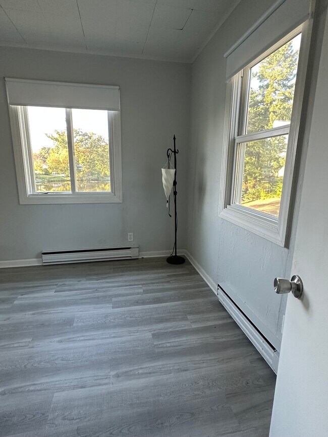 Bedroom #1 with lake views through both windows as well. - 16 Crescent Beach Dr