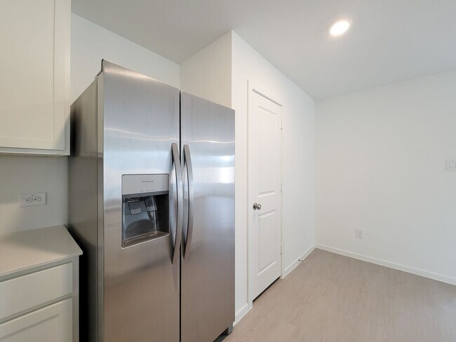 Building Photo - This great new single-story design makes smart use of the space available. At the front are all t...