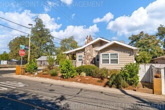 Building Photo - Welcome to this stunning 4-bedroom, 2-bath...