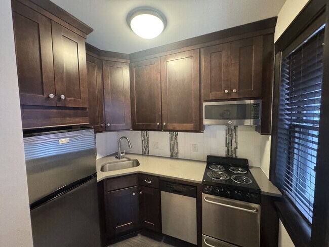 Building Photo - "Charming Studio Retreat with Hardwood Elegance in Downtown Minneapolis!"