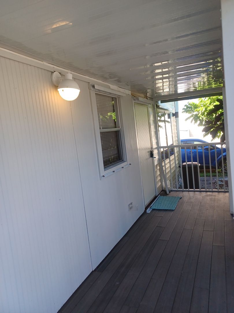 Building Photo - COMING EARLY JUNE: ISLAND LIVING IN BOKEELIA: 1 BD / 1.5 BR Front Screened Lanai