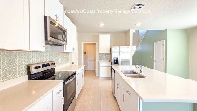 Building Photo - BRILLIANT and SPACIOUS! 4 BEDROOM/2.5 BATH PLUS LARGE BONUS-FLEX SPACE and FENCED YARD!