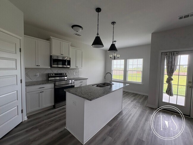 Building Photo - The perfect blend of modern living and small-town charm