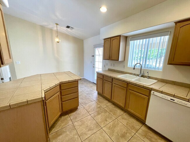 Building Photo - Inviting 3 Bedroom Home with RV Parking an...