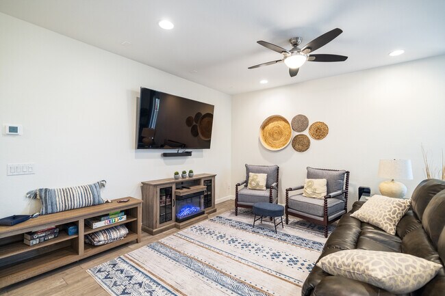 Living room w/75" smart TV - 8924 W Solano Dr