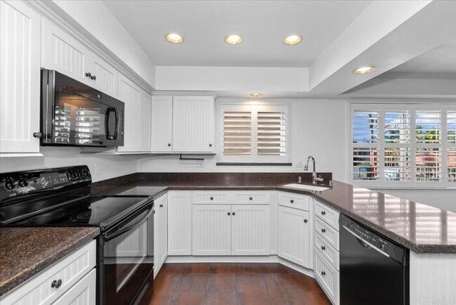 Building Photo - Poolside Living at Its Finest – Turnkey 3BR Condo with Direct Patio Access to the Pool