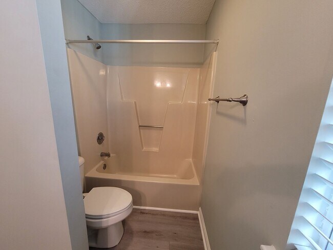 Building Photo - Renovated first floor condo with community...