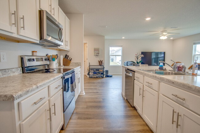 Building Photo - Spacious 4BR Home with 2-Car Garage Near M...