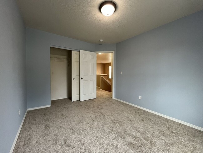 Building Photo - Inviting Two-Story 3BR Home Featuring New Carpet, New Stainless Appliances, Spacious Garage Stora...