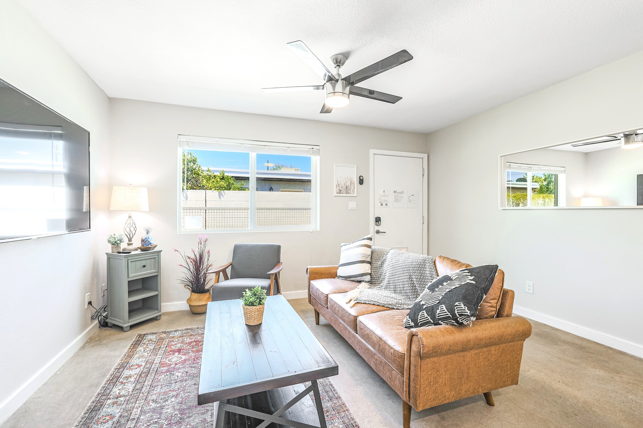 Living room with flat 65" TV - 2821 E Turney Ave