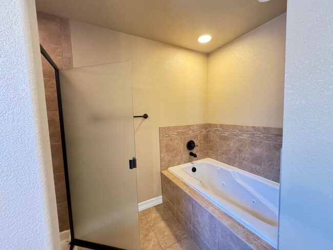 Building Photo - 4 BEDROOM, 3 BATHROOM TWINHOME WITH 2 CAR ATTACHED GARAGE IN NORTH CHEYENNE