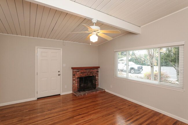 Living room with large picture window & fireplace - 3321 Alma St