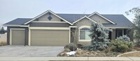 Building Photo - THREE-CAR GARAGE! This charming home offer...