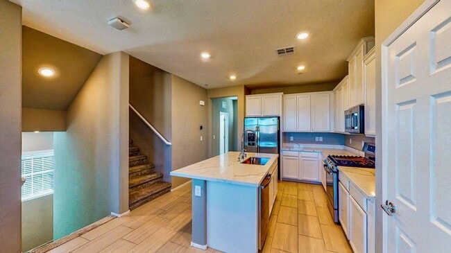Kitchen with stainless appliances, Calacatta quartz countertop - 11944 Tomales Bay St