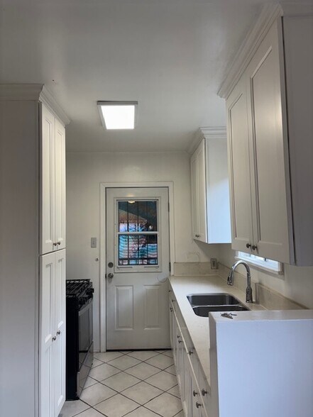 updated kitchen with stove - 4259 Garthwaite Ave